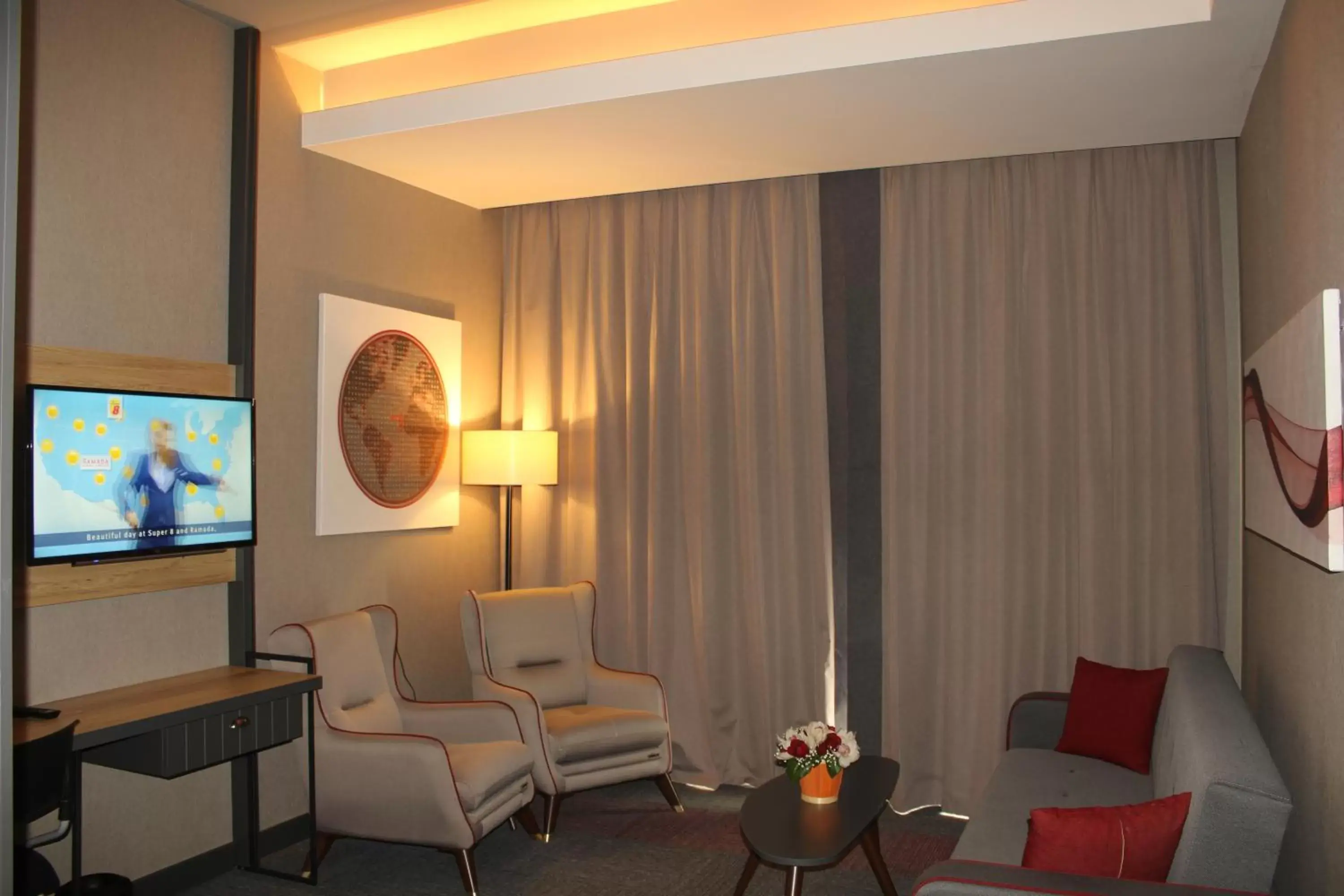 Living room in Ramada By Wyndham Tire